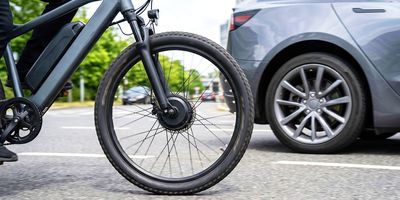 An e-bike rider on a road.